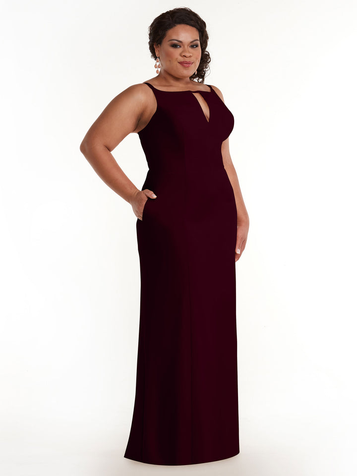 A woman poses against a plain white background wearing Avery Austin&