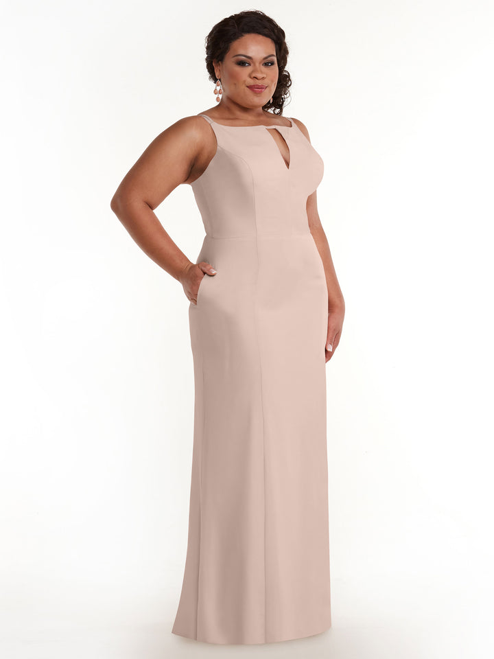 A woman poses confidently against a white background in the Avery Austin 83030 sheath dress, featuring a sleeveless design, rose pink color, pockets, and a subtle keyhole neckline.