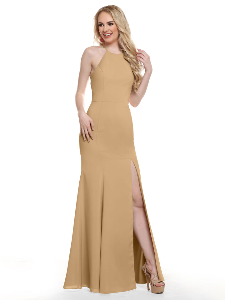 A woman stands smiling against a white background, wearing Avery Austin&