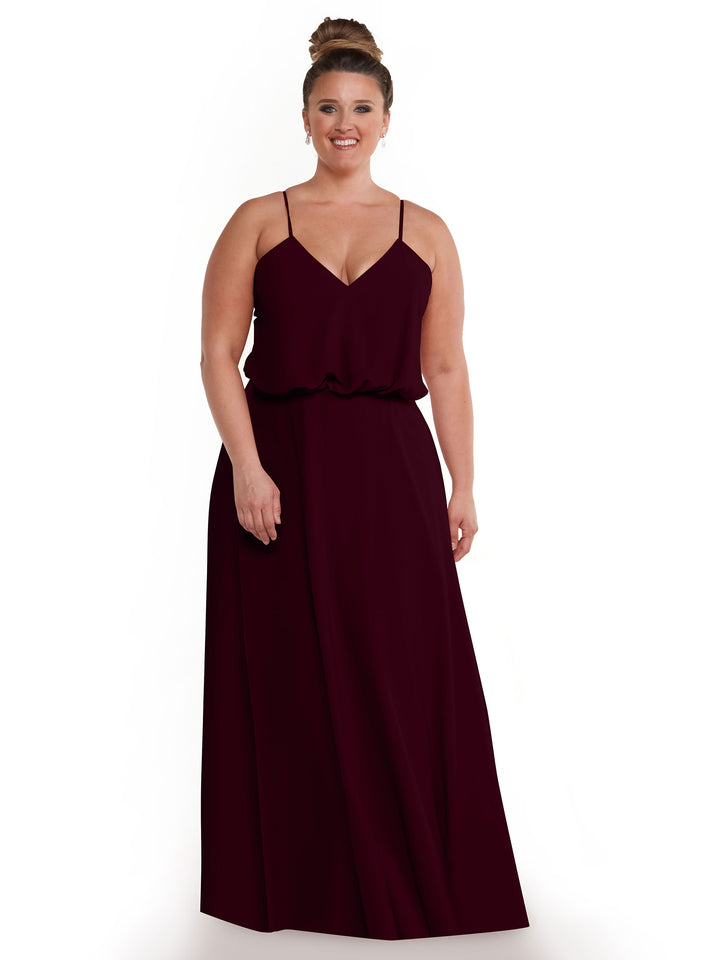 A woman wearing the Avery Austin 83040 dress, featuring a red A-line silhouette and a puffed bodice.