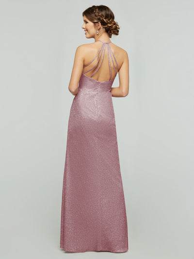 A woman shows off the open back and halter neckline with crisscross straps of the averyaustin 84005 - Tried On Sample, a shimmery mauve glitter knit sheath dress, her hair styled in a braided updo.