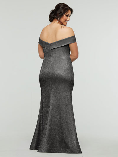 A woman models the averyaustin 84010 - Tried On Sample mermaid dress with sparkling, off-the-shoulder sleeves, smiling over her shoulder against a plain light background.